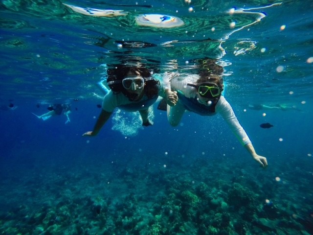 Rae Brook and her friend snorkelling in the ocean