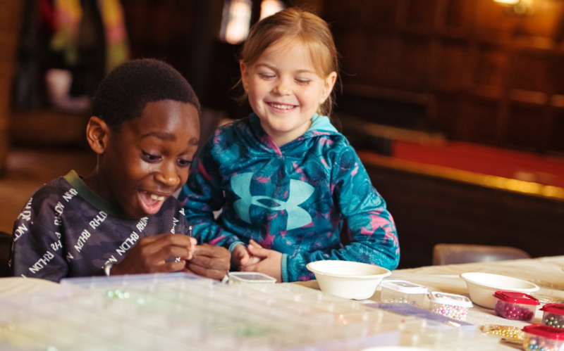 Children laughing while crafting