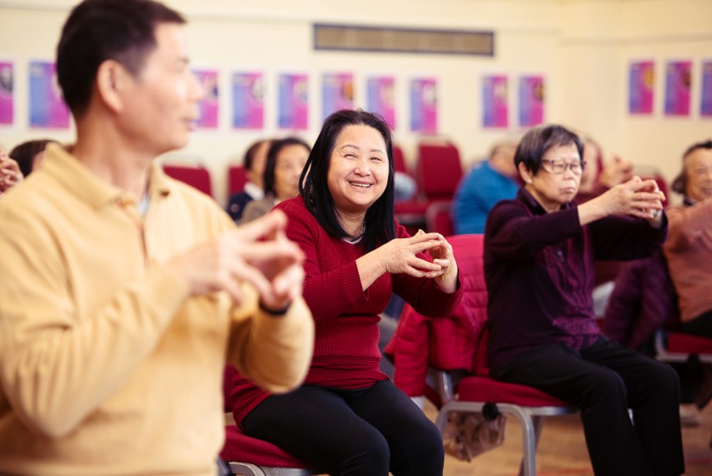 People in a community centre taking part in a workshop